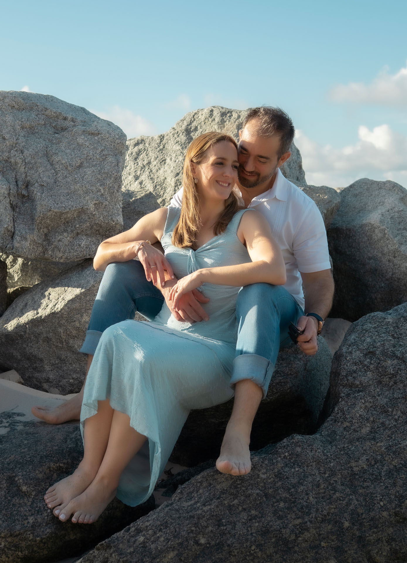 Ingrid and Miguel sitting together on the rocks