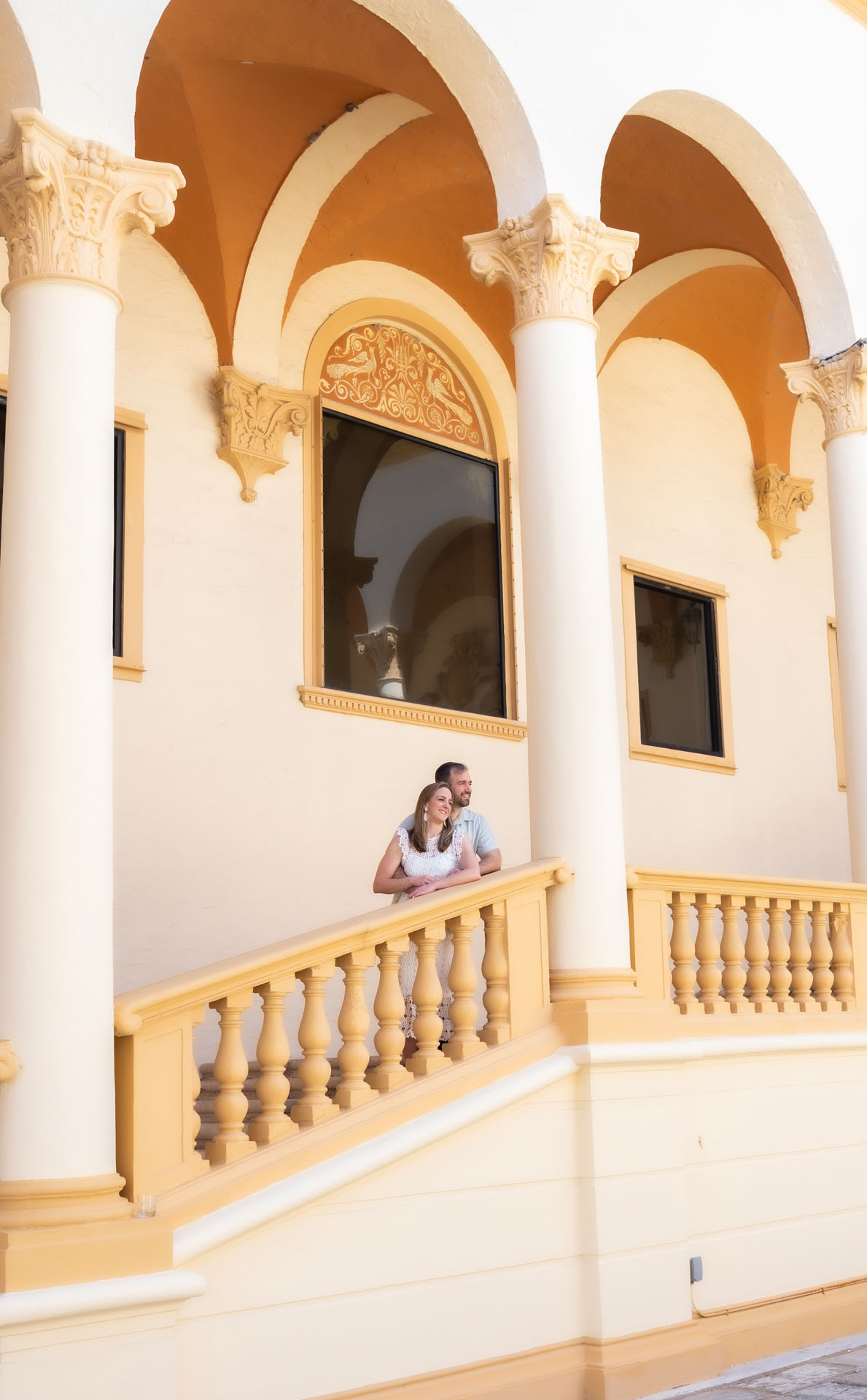 Ingrid and Miguel on a balcony at the Biltmore