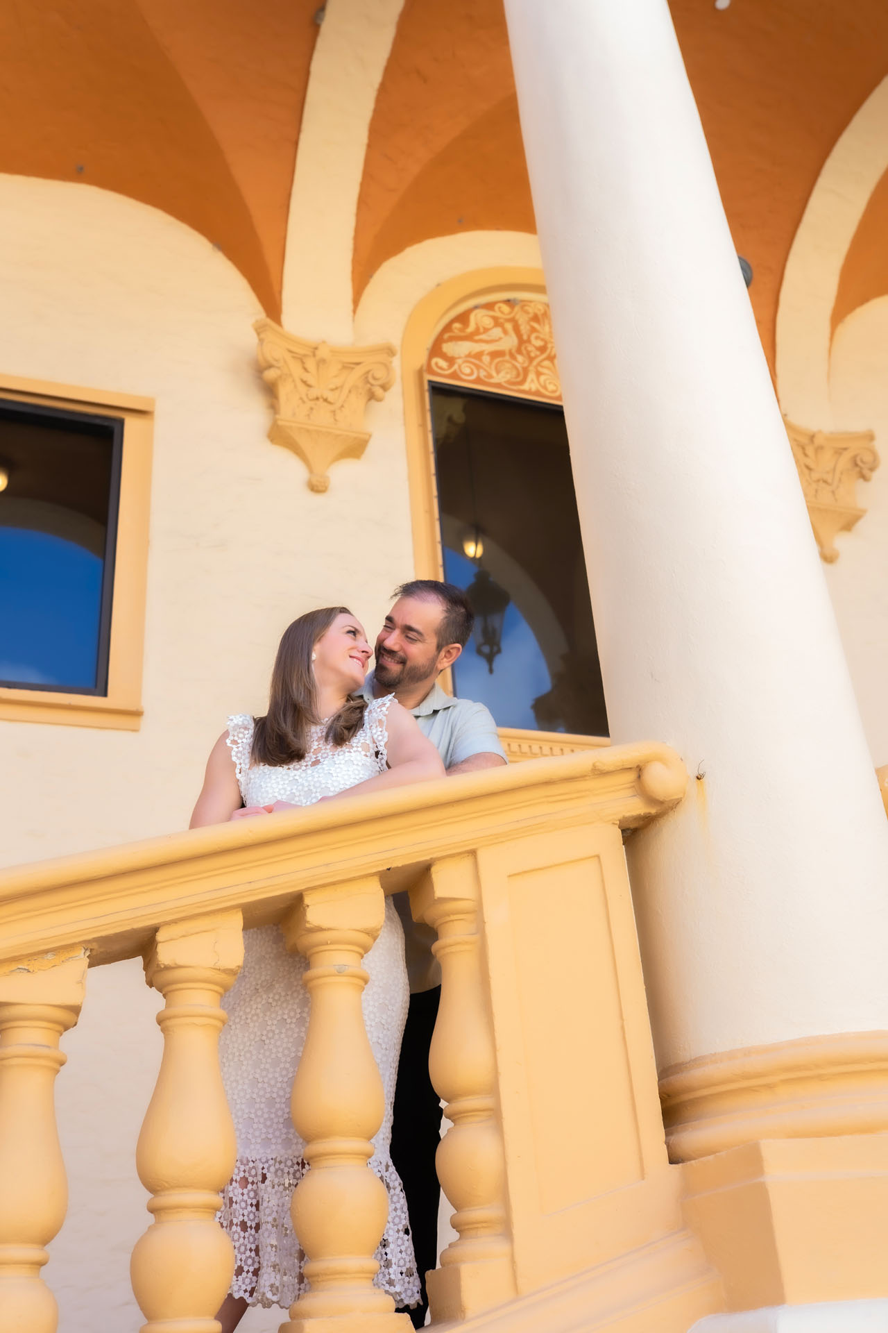 Ingrid and Miguel close together beneath the Biltmore arches